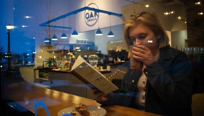 woman drinking coffee in a coffee shop