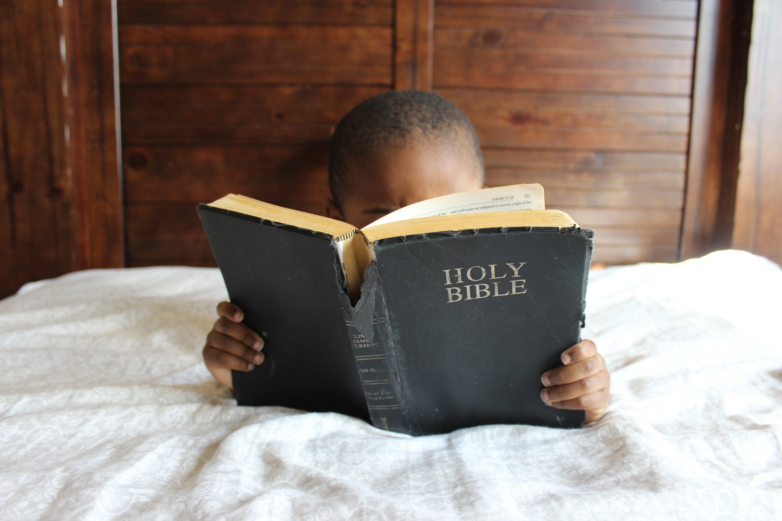 Child holding the holy bible