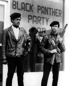 Bobby Seale (left) and Huey Newton (right). Photo from Encyclopedia Britannica.