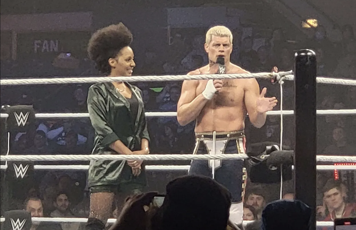 Alicia Taylor stands beside Cody Rhodes in the ring at WWE Live Holiday Tour