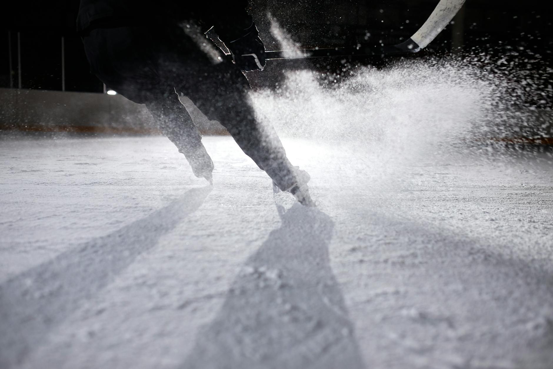 a person ice skating on ice rink